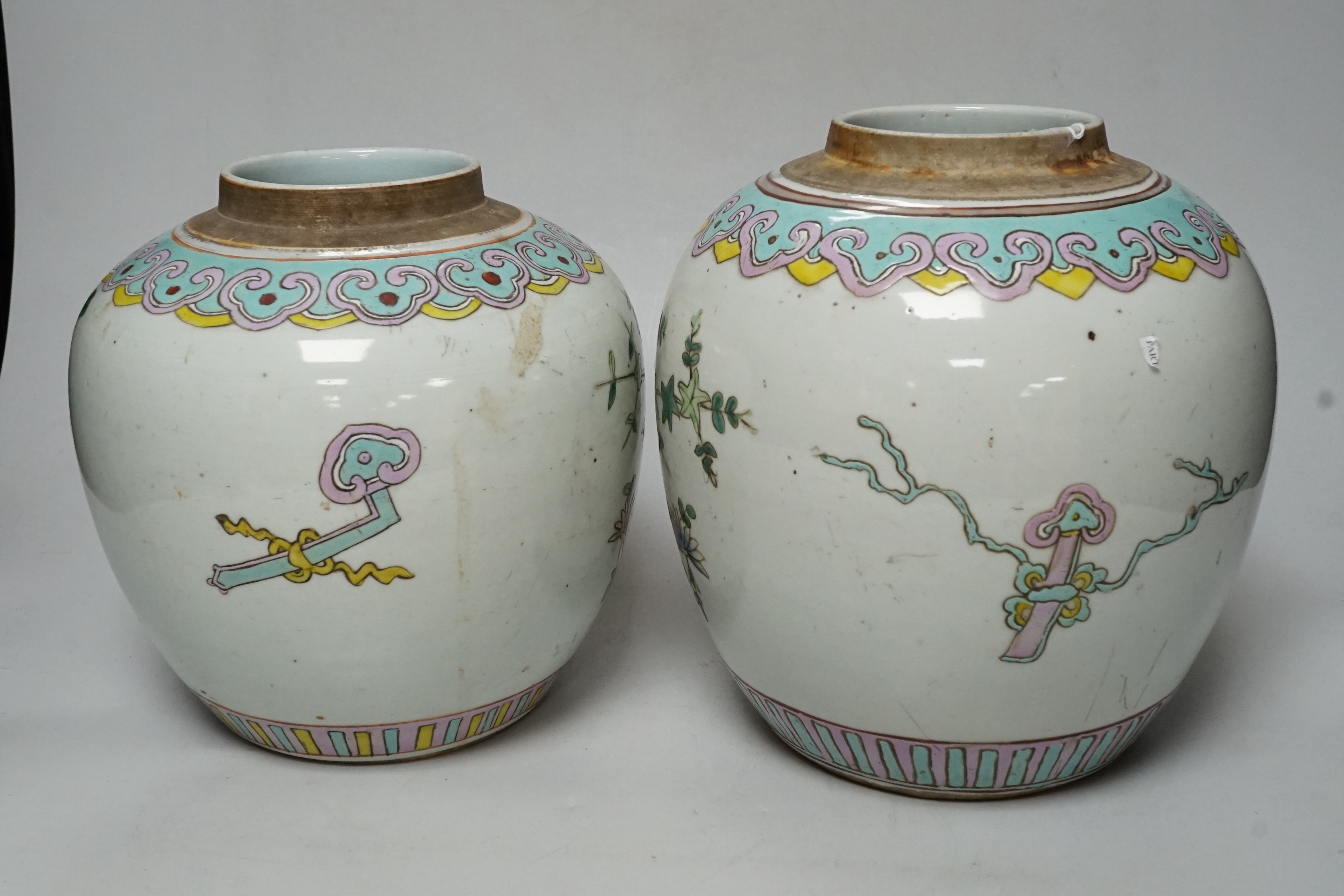 Two graduated 19th century Chinese famille rose ‘phoenix and peony’ ovoid jars, tallest 22cm